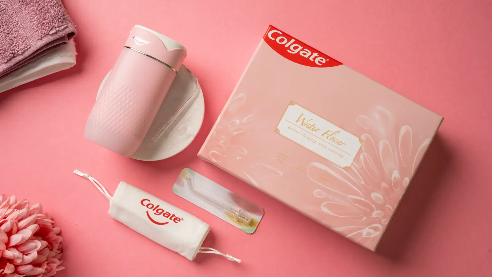 Flosser box, pouch and nozzle on pink