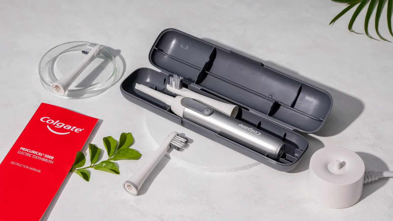 Travel case, manual and heads on white marble